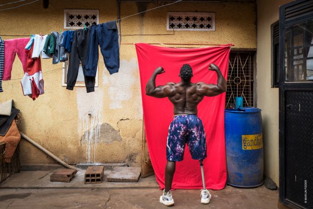 Africa Singles, Marijn Fidder, Bodybuilder Tamale Safalu trains in front of his home, Uganda, 2024, © Marijn Fidder